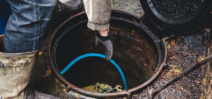 A man repairing a septic tank